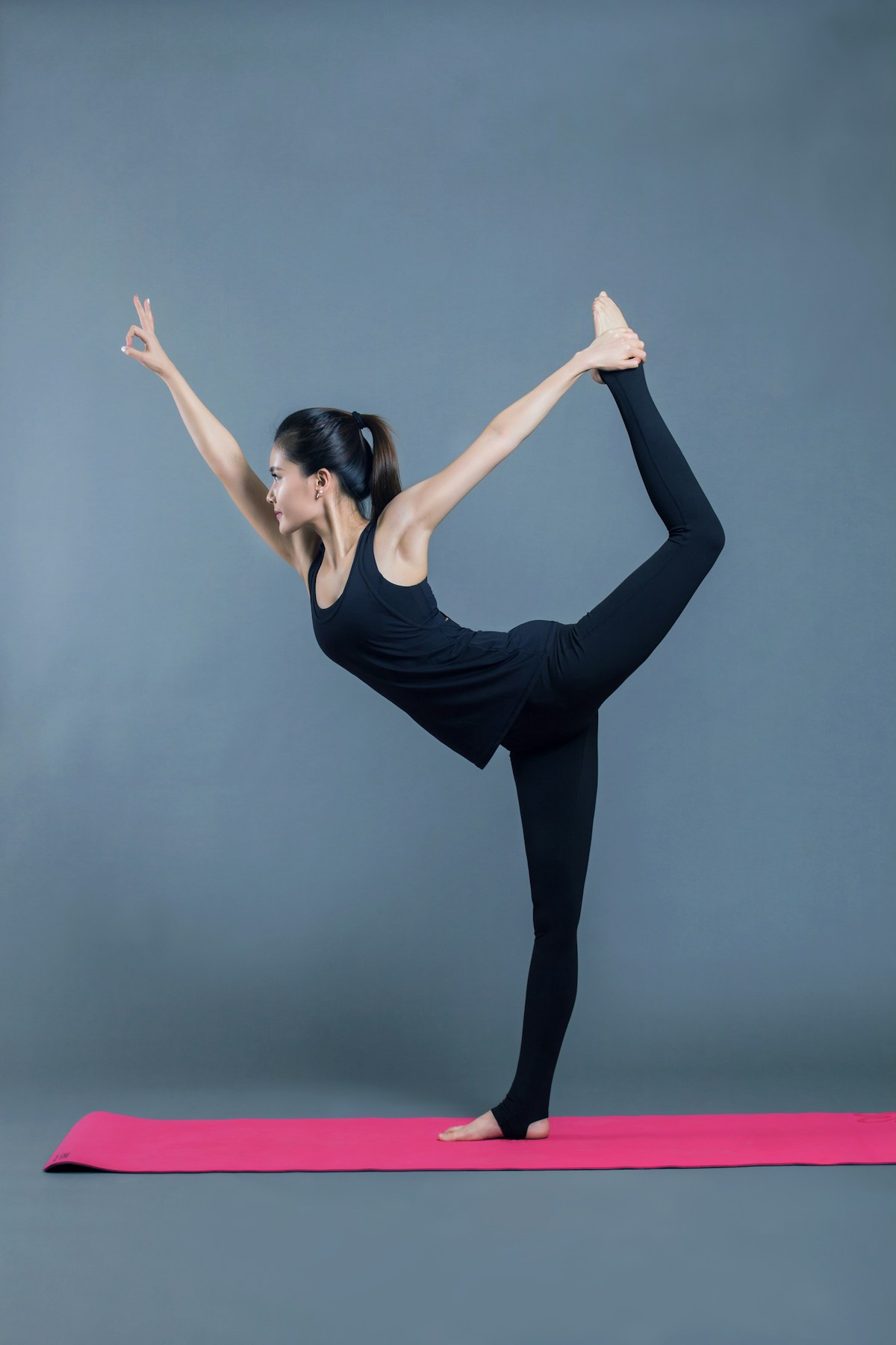 Woman practicing standing yoga